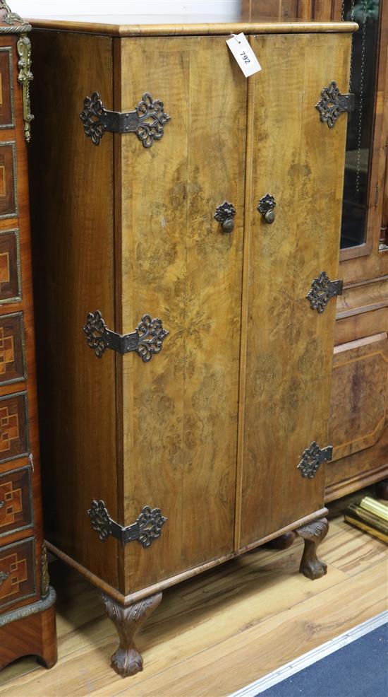 A walnut slender cocktail cabinet W.57cm